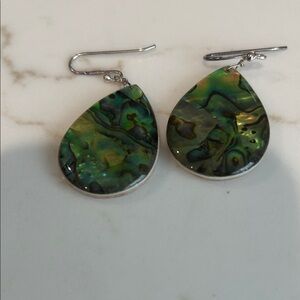 Woman’s Apologia pair of earrings. Back side is peach color.  Dual usage